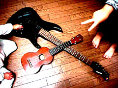 Ukulele, e-guitar, hands